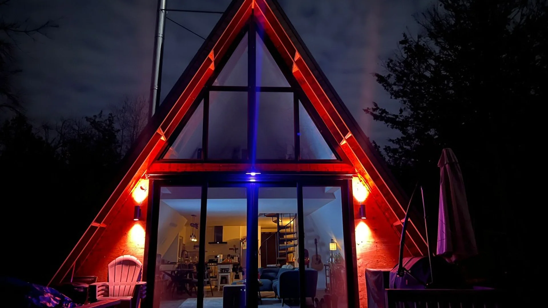 A-frame cabin renovation at night